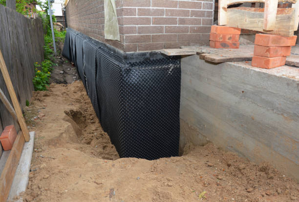 SJ Waterproofing Pros technician performing targeted Waterproofing assessment in Harrisburg, IL